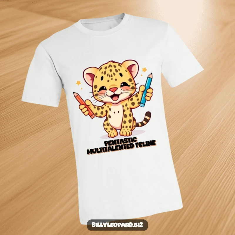 Funny t-shirt showcasing an energetic leopard cub intensely juggling three different colored pens with sheer delight, ideal for humor lovers.