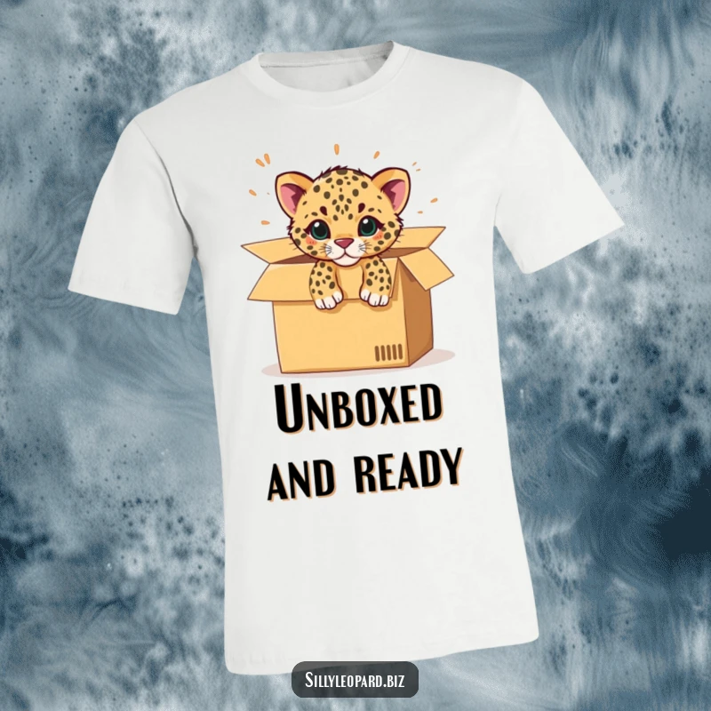 Funny t-shirt featuring a spotted leopard cub dramatically bursting out of an open office cardboard box, full of excitement.